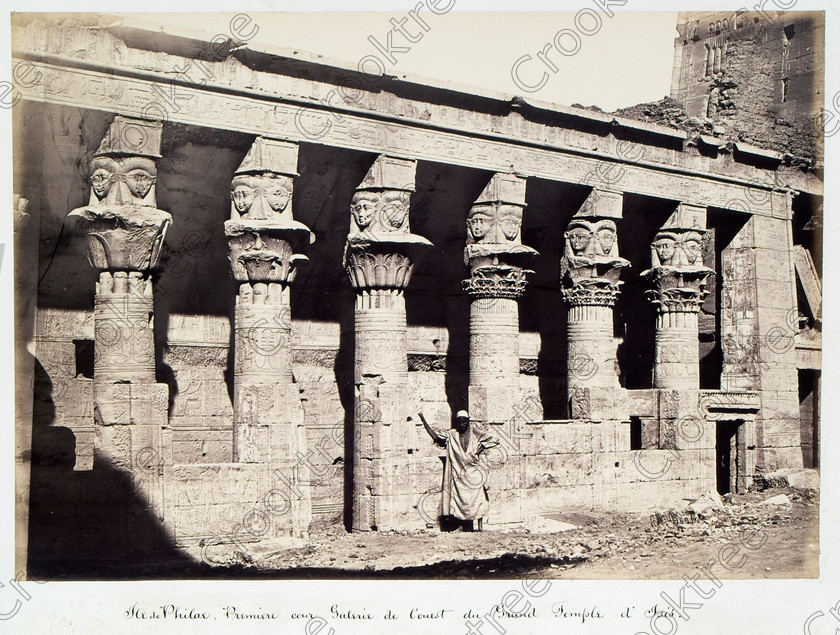 Beato Philae Temple 27JHP05 
 Philae Temple Birth House Capitals Columns Beato Old Photo Albumen Egyptian Custodian on its original island location in the River Nile, dedicated to the Goddess Isis and here photographed by Antonio Beato, a Victorian photographer around 1890 and this copy is taken from his album called The Nile 1872. 
 Keywords: Egypt, Aswan, Nubia, River Nile, Philae, Temple, Island, Isis, birthhouse, birth, house, Hathor, faces, water, history, antiquity, Egyptian, ancient, archaeology, Egyptology, landscape, Antonio Beato, Victorian, photographer, earliest, albumen, print, copy