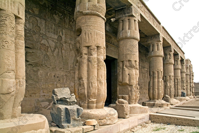 Seti 1 Temple EG053406JHP 
 Qurna Ancient Egypt Thebes Luxor Temple Seti Front Columns Carvings on the West Bank of the River Nile at Luxor in an area called al-Tarif turning off eastwards instead of taking the Valley of the Kings road. Attributed to Seti it had involvement by Ramasses 1 and 11 and with recent restoration is a delightful extra addition should you have free time while in Luxor and described in the early days as Goorneh Temple. 
 Keywords: Egypt, Luxor, Thebes, River Nile, West Bank, Tarif, village, Temple, Sethos, Seti, Sety, Ramses, mortuary, Dra Abu el-Naga, Qurna, Goorneh, landscape, portico, front, papyrus, bud, columns, necropolis, sandstone, wall, reliefs, bas, painted, coloured, colours, colors, history, archaeology, ancient, Egyptian, Egyptology, decorated