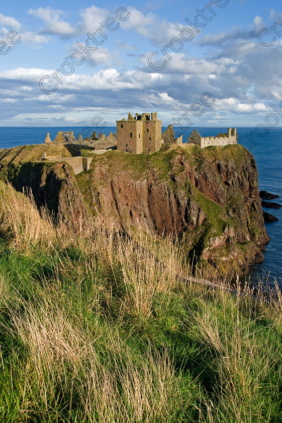 Dunnottar Castle Scotland VS2903JHP 
 Dunnottar Castle viewed from the top of the treacherous and steep cliiffs that had to be negotiated on any approach to the fortress on top of its rocky outcrop.
As a private property these photographs should only be used for tourist/scenic/editorial purposes. If required for commercial promotion then permission should be obtained from the owners by contacting The Factor; Dunecht Estates Office; Dunecht; Skene; AB32 7AX. Telephone: 01330 860223. 
 Keywords: Scotland, Scottish, Aberdeenshire, North, east, sea, Stonehaven, Kincardineshire, north, Dunnottar Castle, haven bay, castle, Dunnottar, Castle, upright, spectacular, coast, coastal, cliffs, rocks, headland, bay, Haven, Benholm, Lodging, keep, tower, curtain, portcullis, vaulted, pends, arched, window, stonework, weathered, erosion, conglomerate, pudding, stone, Dun, Fother, 14th, century, Marischal, storehouse, smithy, bakery, brewery, stables, guardhouse, quadrangle, well, mansion, chambers, chapel, Whig's Vault, prison, dungeon, siege, Honours, jewels, Covenanters, exhibition, fortress’ ‘benholm lodging’, dun, fother, marischal, whig's vault