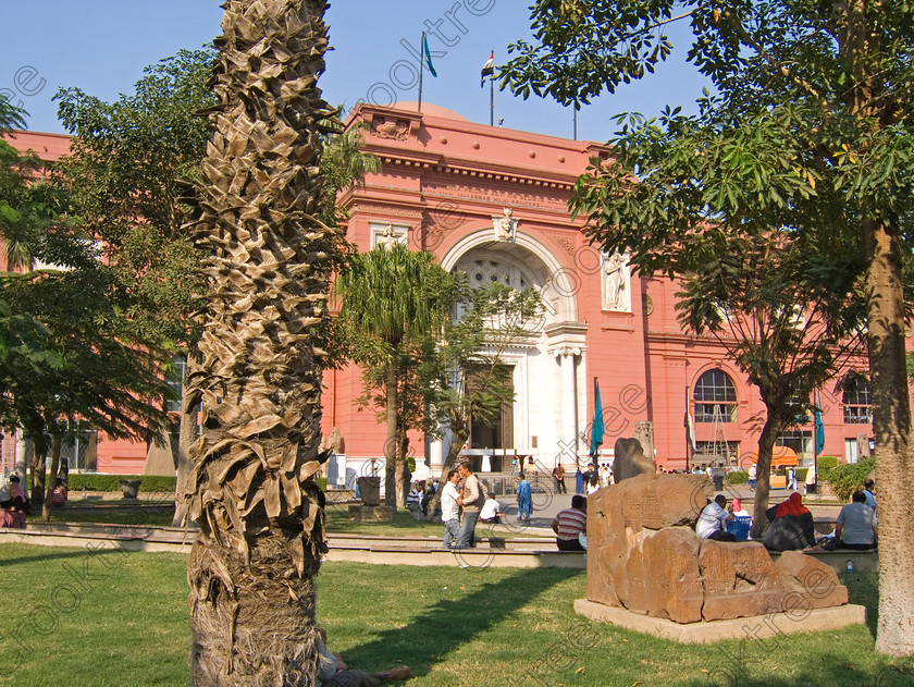 Cairo Egyptian Museum EG072608JHP 
 Egyptian Museum Cairo gardens seats exhibits entrance palm trees maindoor in the prime antiquities collection in Cairo taken during visits between 1994 and 1996 when photography was allowed albeit without flash and tripod. None is of studio quality, being handheld with existing, usually extremely poor light and using slide film, pushed Fuji 400asa to get a suitable aperture and shutter speed. Most of the photos are from the Tutankahum exhibits while the rest are items that interested me as I explored this wonderful and extensive collection, requiring many more hours if not days and is only hinted at during the usual one or two hour visit made on a package tour. 
 Keywords: Egypt, Cairo, Egyptian, Museum, Mariette, entrance, front, collection, landscape, ancient, antiquity, antiquities, exhibits