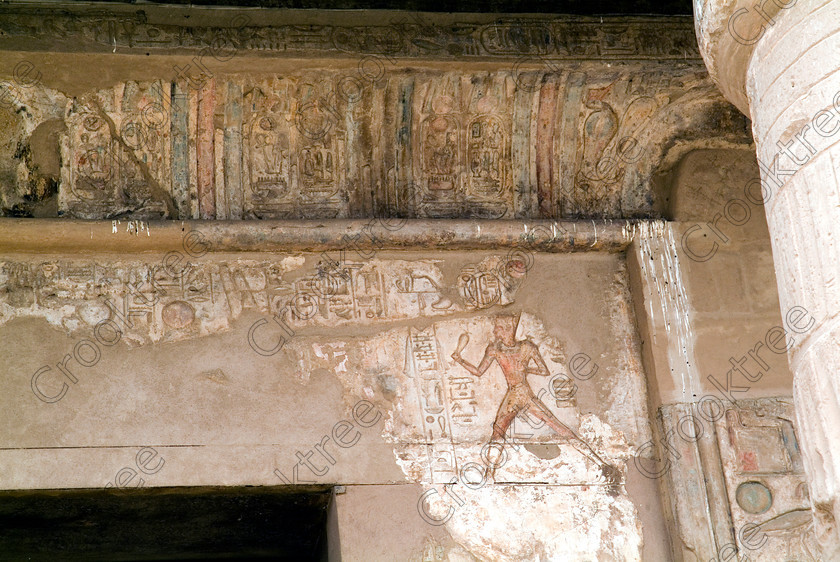 Seti 1 Lintel EG053377JHP 
 Temple Egyptian Warrior King Figure Lintel Ceiling Interior Seti 1 Photographer on the West Bank of the River Nile at Luxor in an area called al-Tarif turning off eastwards instead of taking the Valley of the Kings road. Attributed to Seti it had involvement by Ramasses 1 and 11 and with recent restoration is a delightful extra addition should you have free time while in Luxor and described in the early days as Goorneh Temple. 
 Keywords: Egypt, Luxor, Thebes, River Nile, West Bank, Tarif, village, Temple, Sethos, Seti, Sety, Ramses, mortuary, Dra Abu el-Naga, Qurna, Goorneh, landscape, interior, lintel, cobra, snake, uraeus, sandstone, wall, reliefs, bas, painted, coloured, colours, colors, history, archaeology, ancient, Egyptian, Egyptology, decorated